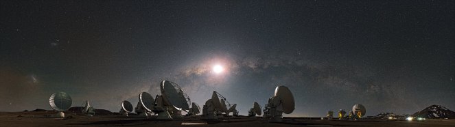An image of the moon and the Milky Way over some of the radio dishes of the Atacama Large Millimeter Array (ALMA) in Chile. [Image: ESO/S. Guisard]